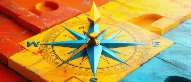 Farbiger Kompass auf farbenfroher Karte